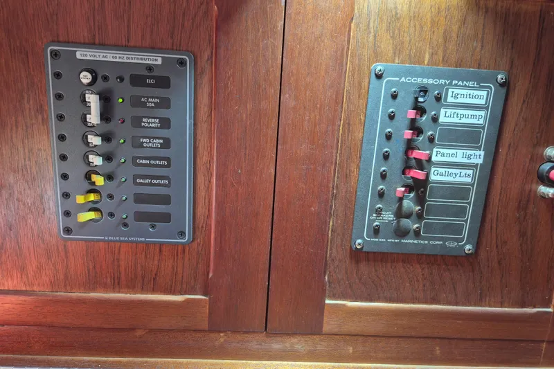 Pearl Yacht Photos Pics Electrical panels on a 1996 Cape George 36 boat, featuring switches and circuit breakers.