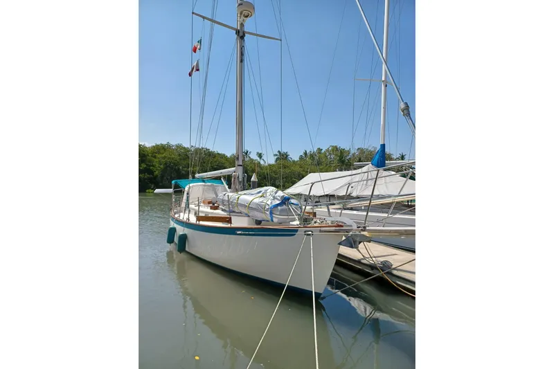 Pearl Yacht Photos Pics Sailboat docked, 1996 Cape George 36, sunny day, marina setting.