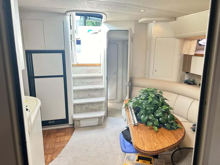 Intrepid Yacht Photos Pics Interior of 1997 Cruisers Yachts 4270 Esprit with cozy seating and dining area.