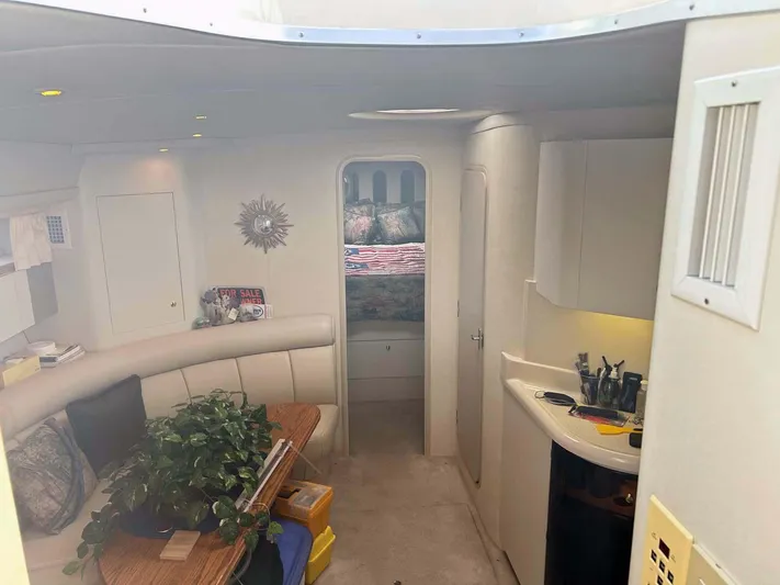 Intrepid Yacht Photos Pics Interior of 1997 Cruisers Yachts 4270 Esprit, featuring cozy seating and modern amenities.