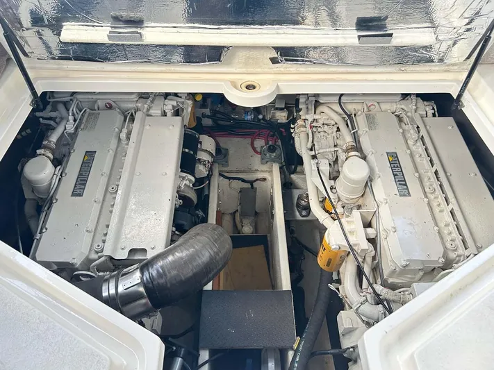 Intrepid Yacht Photos Pics Engine compartment of a 1997 Cruisers Yachts 4270 Esprit, featuring dual engines.