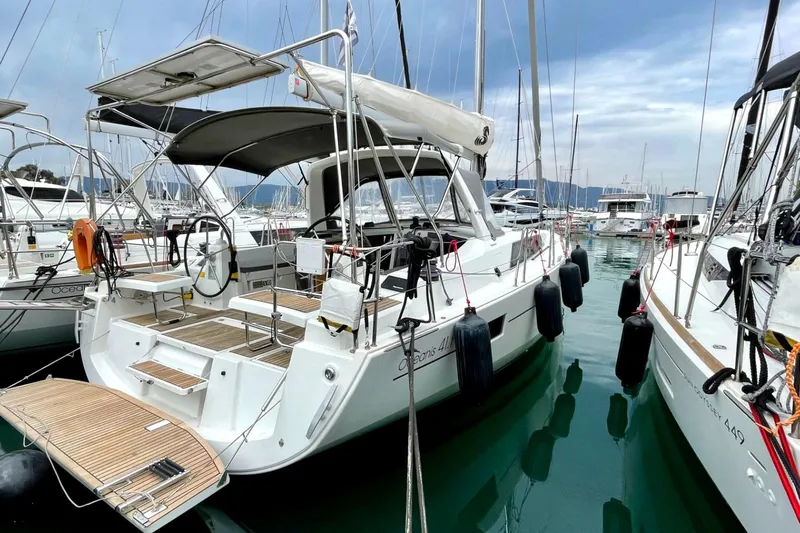  Yacht Photos Pics 2017 Beneteau Oceanis 41.1 sailboat docked in marina, featuring spacious deck and modern design.