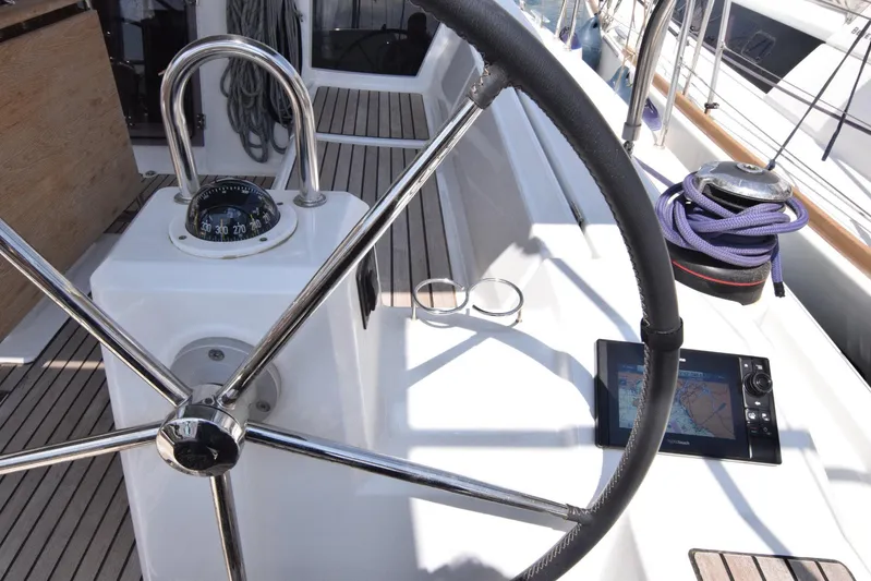  Yacht Photos Pics Steering wheel and navigation equipment on a 2017 Beneteau Oceanis 41.1 sailboat.