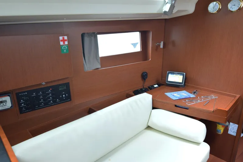  Yacht Photos Pics Interior of 2017 Beneteau Oceanis 41.1 yacht with navigation station and seating area.
