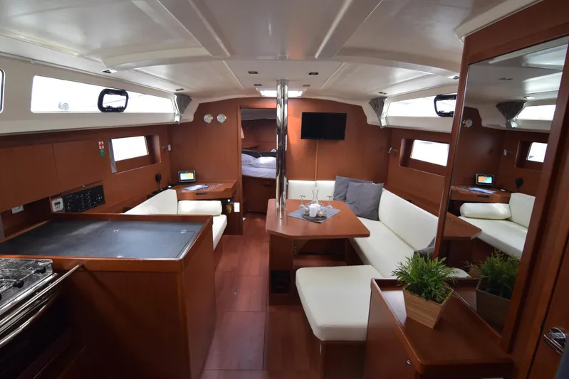  Yacht Photos Pics Interior of 2017 Beneteau Oceanis 41.1 yacht with modern furnishings and cozy seating area.