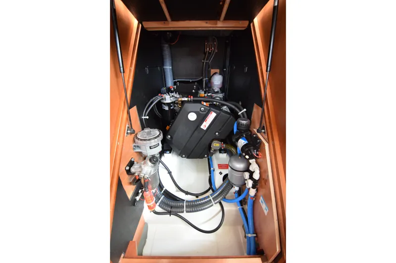  Yacht Photos Pics Engine compartment of 2017 Beneteau Oceanis 41.1 sailboat, showcasing mechanical components.