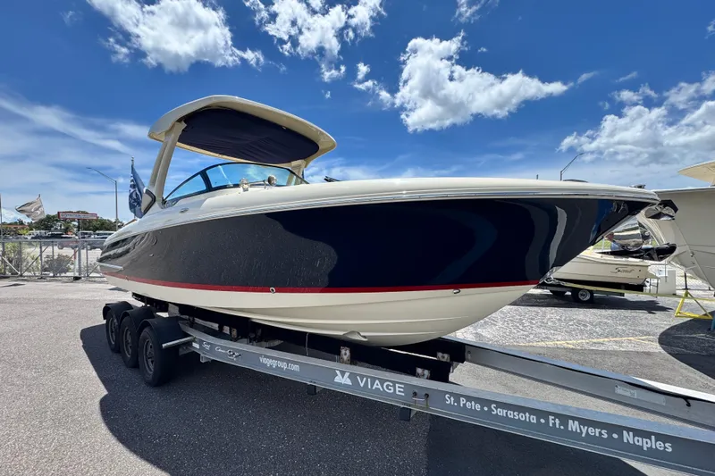  Yacht Photos Pics 2026 Chris-Craft Sportster 28 boat on trailer under clear blue sky.
