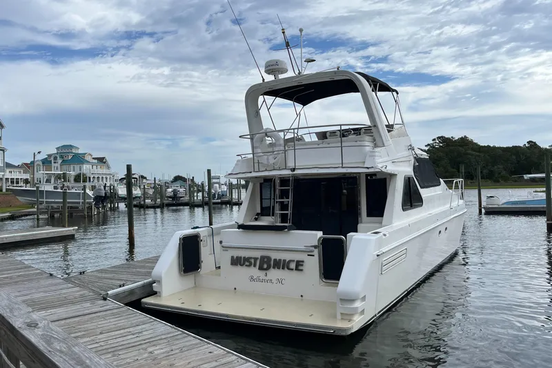 Must B Nice Yacht Photos Pics Custom Sports Catamaran 44, 2001 model, docked at marina with scenic waterfront view.