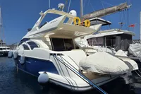 Luxury 2011 Azimut 55 EVOLUTION yacht docked in marina, featuring sleek design and modern amenities.