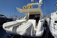 Luxury Azimut 55 EVOLUTION yacht, 2011 model, docked in a marina under clear blue skies.