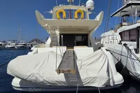 Luxury Azimut 55 EVOLUTION yacht, 2011 model, docked in a marina with clear blue skies.
