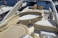 Luxurious 2011 Azimut 55 EVOLUTION yacht with spacious outdoor seating and table.