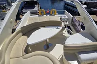 Luxurious seating area on 2011 Azimut 55 EVOLUTION yacht, docked at marina.