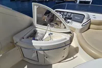 Luxurious 2011 Azimut 55 EVOLUTION yacht cockpit with grill and navigation controls.