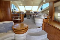 Luxurious interior of 2011 Azimut 55 EVOLUTION yacht with elegant wood and leather furnishings.