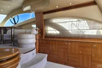 Luxurious interior of 2011 Azimut 55 EVOLUTION yacht with elegant wood and leather finishes.