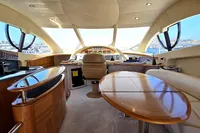 Luxurious interior of 2011 Azimut 55 EVOLUTION yacht with elegant wood finishes.