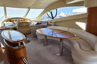 Luxurious interior of 2011 Azimut 55 EVOLUTION yacht with elegant seating and helm station.