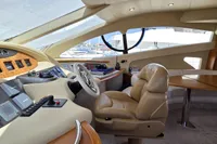 Luxurious interior of 2011 Azimut 55 EVOLUTION yacht cockpit with leather seating and control panel.