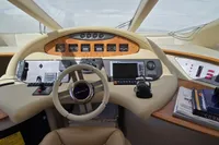 Cockpit of 2011 Azimut 55 EVOLUTION yacht with steering wheel and navigation controls.
