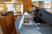 Luxurious interior of 2011 Azimut 55 EVOLUTION yacht with modern kitchen amenities.