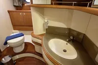 Luxurious bathroom in 2011 Azimut 55 EVOLUTION yacht with modern fixtures and wooden accents.