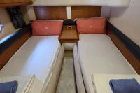 Twin cabin interior of 2011 Azimut 55 EVOLUTION yacht with cozy bedding.