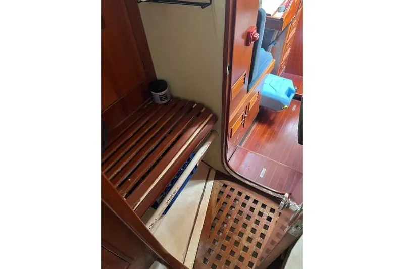 Pickle Yacht Photos Pics Interior of 1989 Hylas 44 sailboat with wooden flooring and storage area.