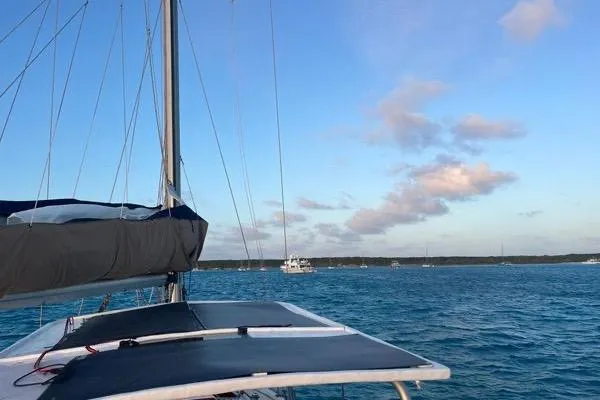 Pickle Yacht Photos Pics Sailing on a 1989 Hylas 44 yacht in clear blue waters under a bright sky.