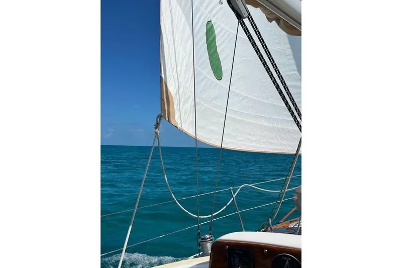 Pickle Yacht Photos Pics Sailing on a 1989 Hylas 44 yacht with clear blue ocean and sky.