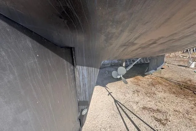 Pickle Yacht Photos Pics Bottom view of a 1989 Hylas 44 sailboat hull and propeller on dry dock.