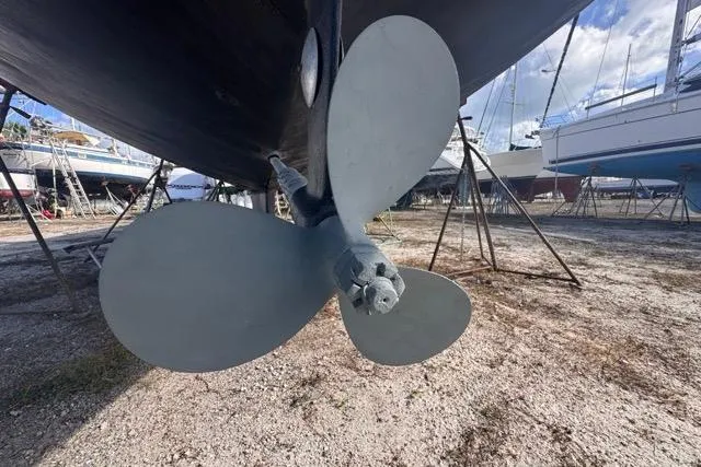 Pickle Yacht Photos Pics Propeller of 1989 Hylas 44 sailboat on dry dock, surrounded by other boats.