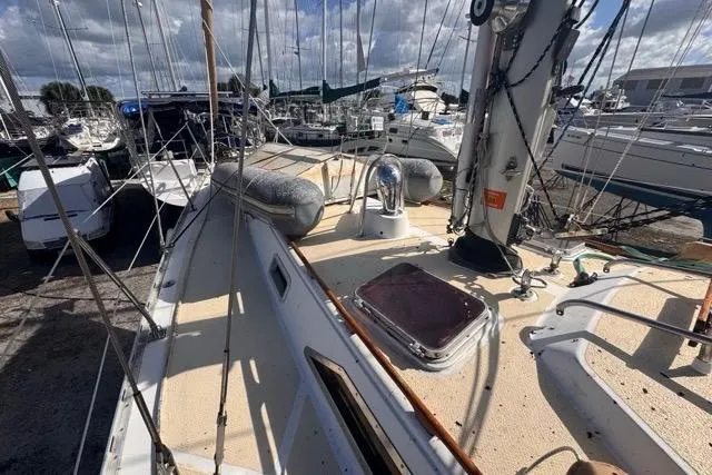 Pickle Yacht Photos Pics 1989 Hylas 44 sailboat deck view in marina, showcasing rigging and hatch.