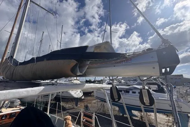 Pickle Yacht Photos Pics Sailboat Hylas 44 from 1989 docked under cloudy sky.