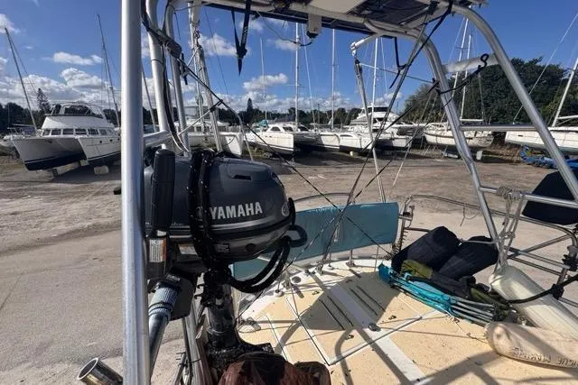Pickle Yacht Photos Pics 1989 Hylas 44 sailboat with Yamaha motor, docked in a marina with other boats.