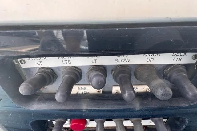 Pickle Yacht Photos Pics Control panel of a 1989 Hylas 44 yacht with labeled switches.