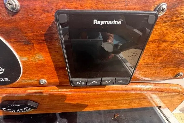 Pickle Yacht Photos Pics Raymarine navigation display on 1989 Hylas 44 yacht's wooden dashboard.