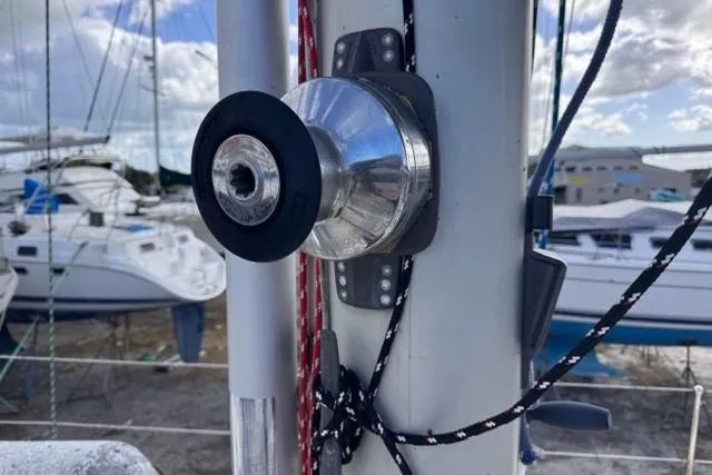 Pickle Yacht Photos Pics Close-up of a 1989 Hylas 44 sailboat mast with rigging and winch.