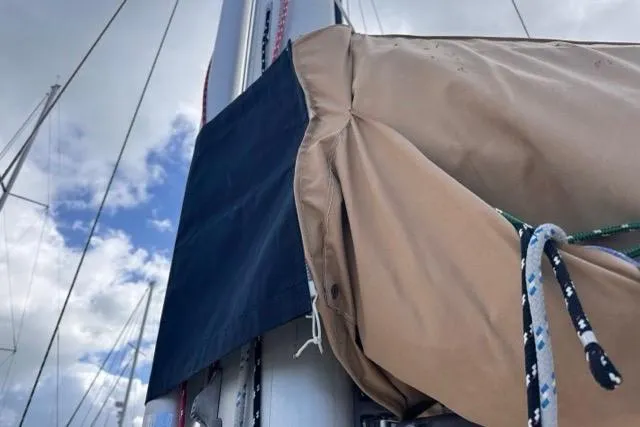 Pickle Yacht Photos Pics Close-up of a 1989 Hylas 44 sailboat mast with rigging and sail cover.