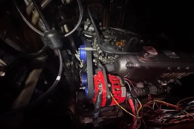 Pickle Yacht Photos Pics Engine compartment of a 1989 Hylas 44 sailboat, featuring visible wiring and components.