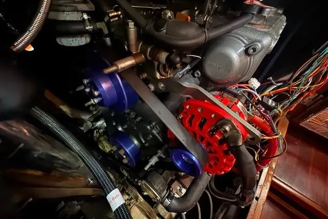 Pickle Yacht Photos Pics Engine compartment of a 1989 Hylas 44 sailboat, showcasing mechanical components and wiring.