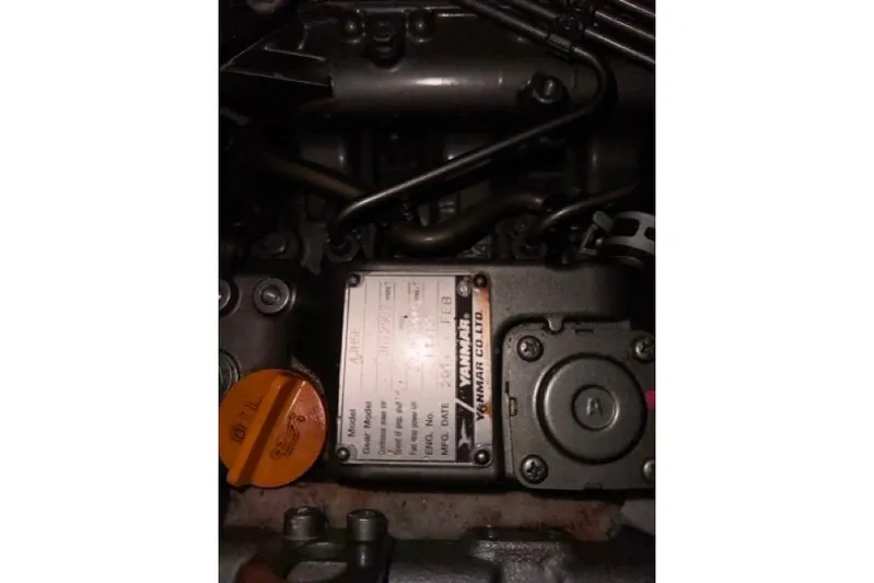 Pickle Yacht Photos Pics Engine compartment of a 1989 Hylas 44 sailboat, featuring Yanmar components.