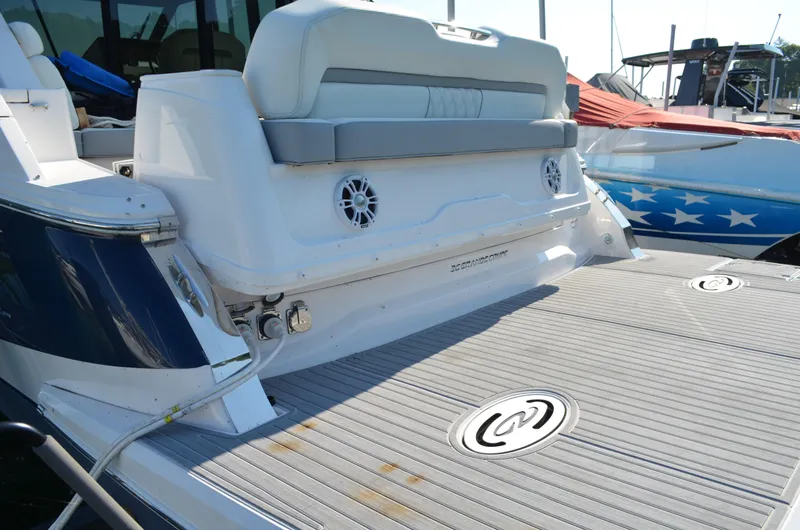  Yacht Photos Pics 2023 Regal 36 Grande Coupe boat with spacious deck and seating area.