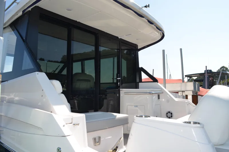  Yacht Photos Pics 2023 Regal 36 Grande Coupe yacht, rear view with seating and glass doors.