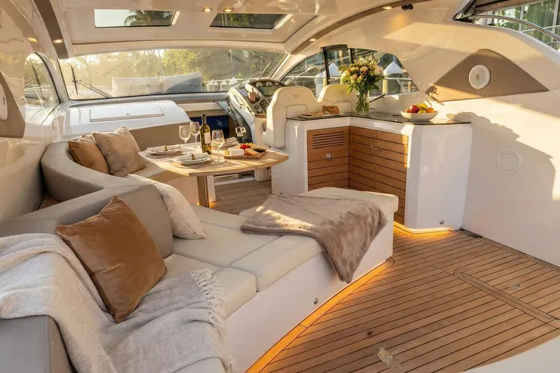  Yacht Photos Pics Luxurious interior of 2024 Sessa Marine C44 Cruiser with elegant seating and dining area.