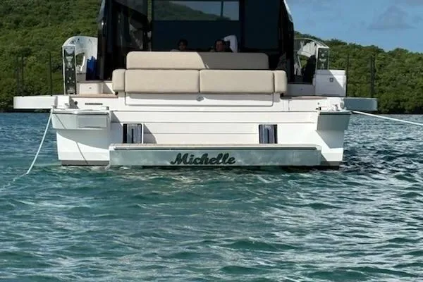 Michelle Yacht Photos Pics 2025 Azimut SeaDeck6 yacht named Michelle on tranquil water.