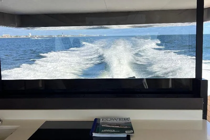 Michelle Yacht Photos Pics 2025 Azimut SeaDeck6 yacht interior with ocean view and wake trail.