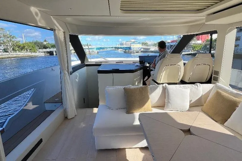 Michelle Yacht Photos Pics Luxurious interior of 2025 Azimut SeaDeck6 yacht with scenic waterfront view.
