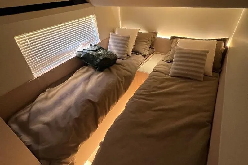 Michelle Yacht Photos Pics Interior of 2025 Azimut SeaDeck6 yacht with twin beds and ambient lighting.
