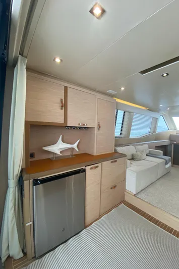 Soulshine Yacht Photos Pics Interior of 2017 Beneteau Monte Carlo MC6 yacht, featuring modern cabinetry and seating area.